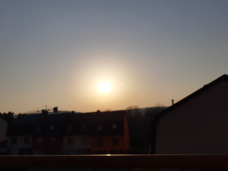 Sunsetting as seen from a balcony
