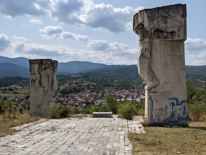 Aerial view of Batak surrounded by two large statues from the top of a nearby hill