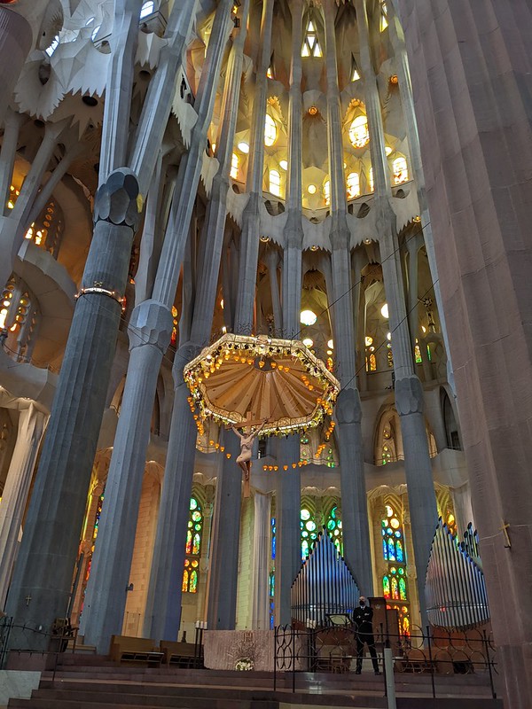 Crucified Jesus hanging over the alter with the organs in the background