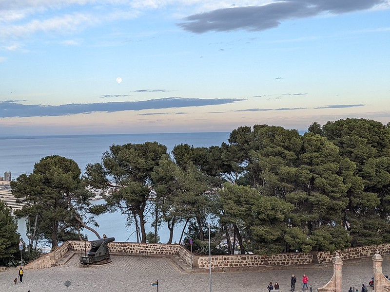 View over the sea from the castle, with the moon in the distance