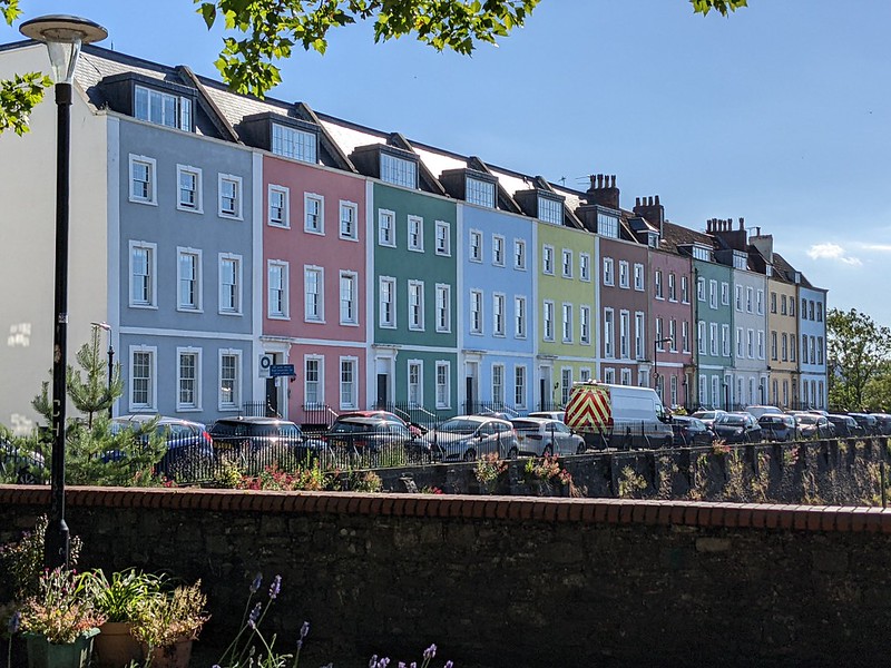 A row of coloured terraced houses overlooking the river Avon (not on photo)
