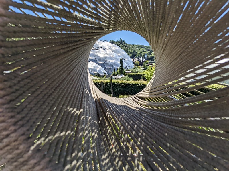 Artistic view of a biodome through twisted ropes creating a circle at the end