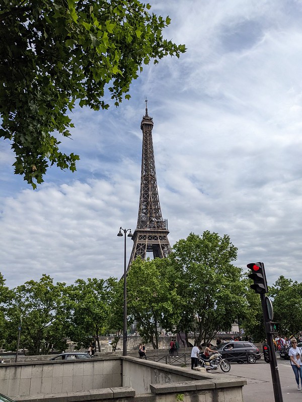 The Eiffel Tower from across the Seine with trees in the foreground