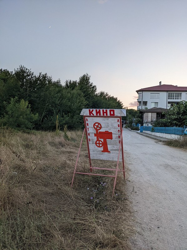 Old style sign indicating the summer cinema in the area