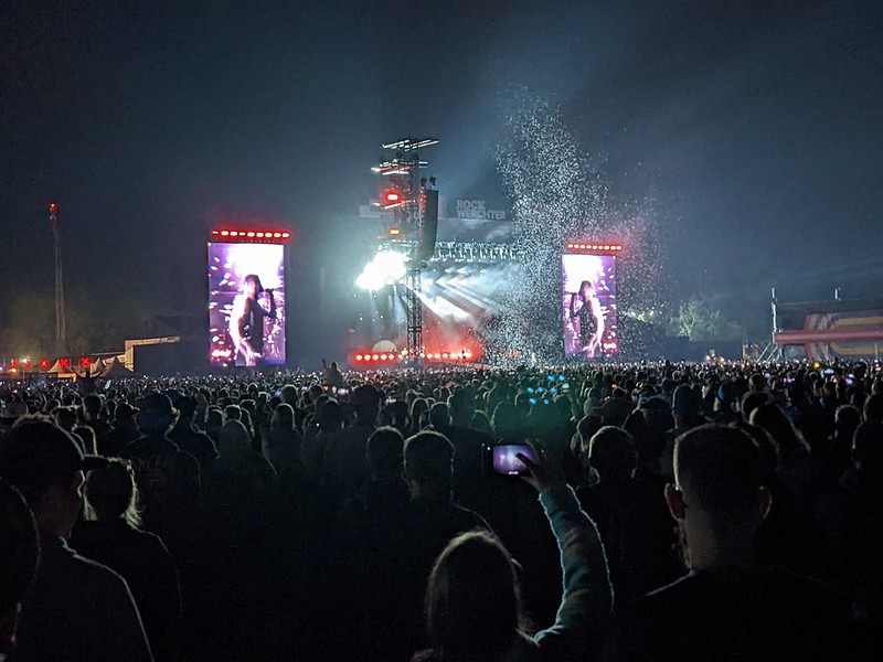 Imagine Dragons from a distance on the main stage in the dark