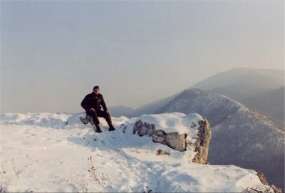 Me sitting on a rock in the snow