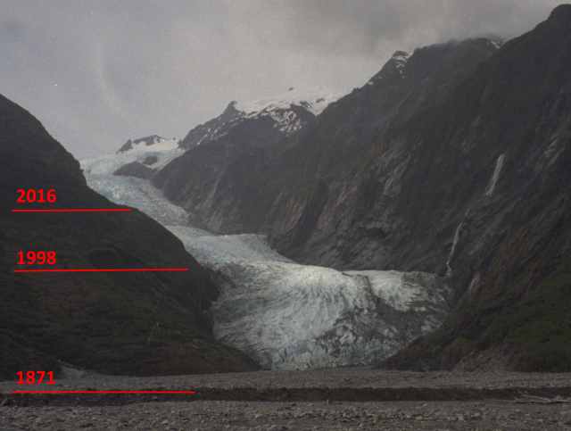 The Franz Josef glacier marked by date lines for 1871, 1998 and 2016 to show far up the hill the glacier has receeded in 1871